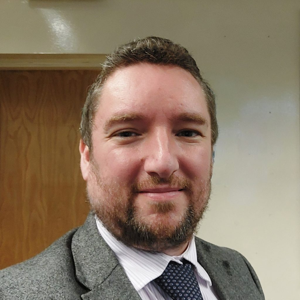 An image of UW partner Adam Reynolds